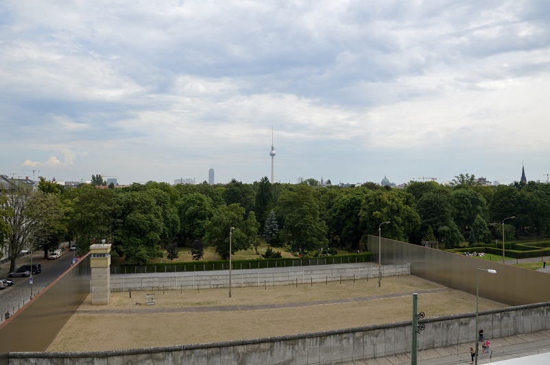 Berlin wall, no man's land, and the TV Tower in the distance in Berlin, Germany