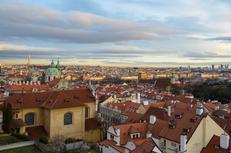 View of Prague with red rooftops at sunset