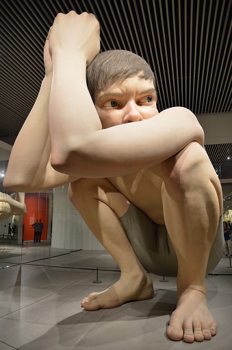 Large sculpture of a boy sitting: Boy at ARoS museum in Aarhus