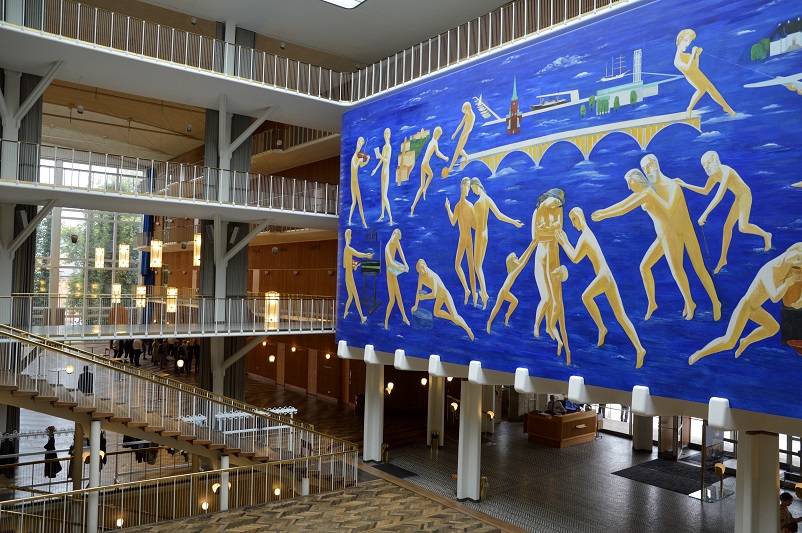 Inside Aarhus City Hall including a blue mural with naked people