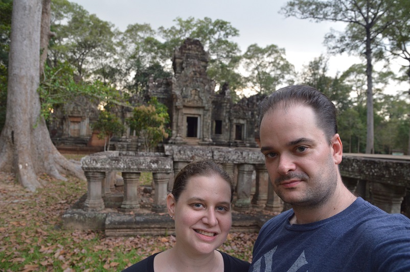 Sarah and Justin in front of an ancient temple at Angkor Archaeological Park in Cambodia