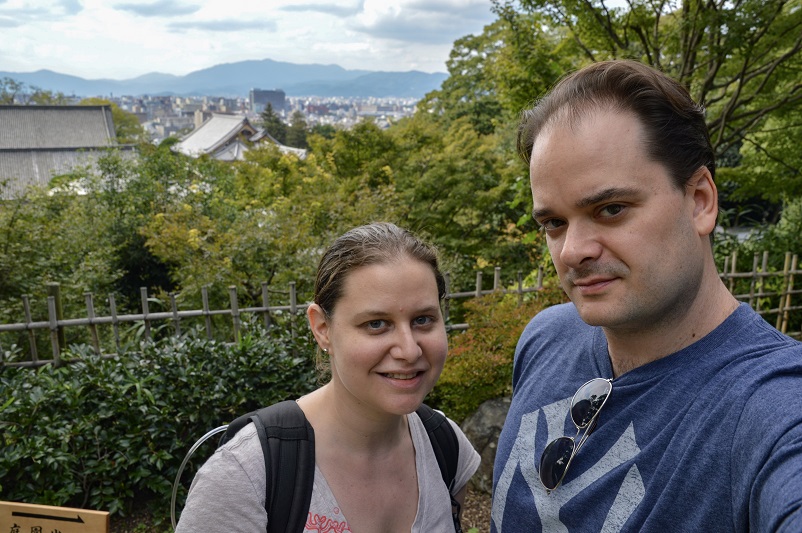 Sarah and Justin smiling in front of a view at Chion-in Temple in Kyoto