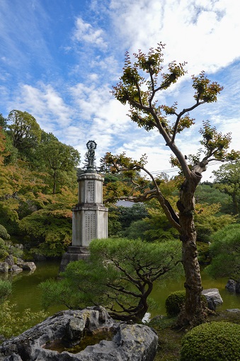 Statue and a tree at Yūzen’en Garden in Kyoto