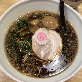 Bowl of dark soy-based ramen at Menya Houten in Fukuoka