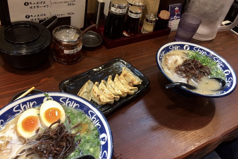 2 bowls of ramen and 1 plate of gyoza at Shin-Shin in Fukuoka