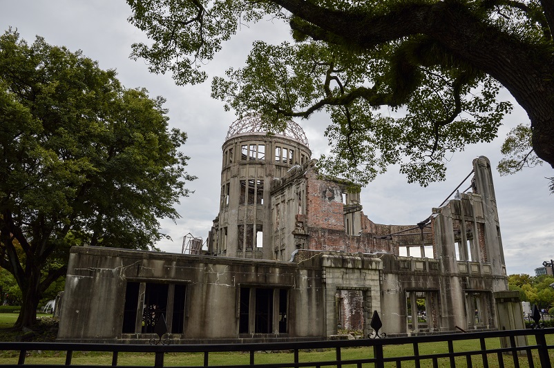 Back view, through trees, of the Atomic Bomb Dome in Hiroshima, Japan