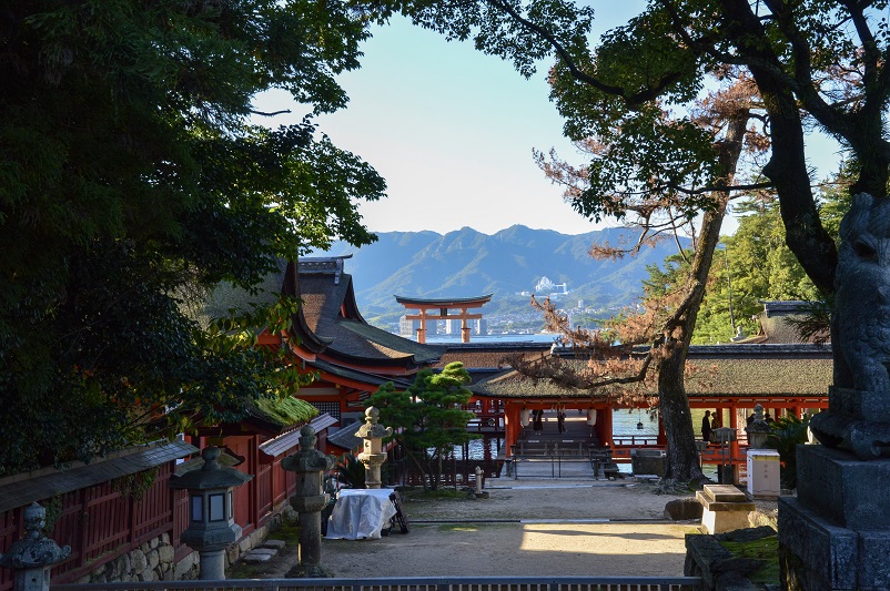 Temple and torii gate through the trees on Miyajima