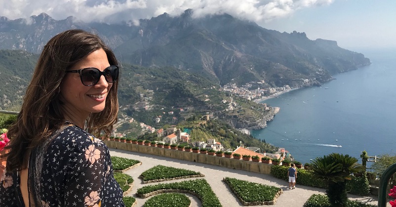 Woman smiling looking out at the Amalfi Coast in Italy