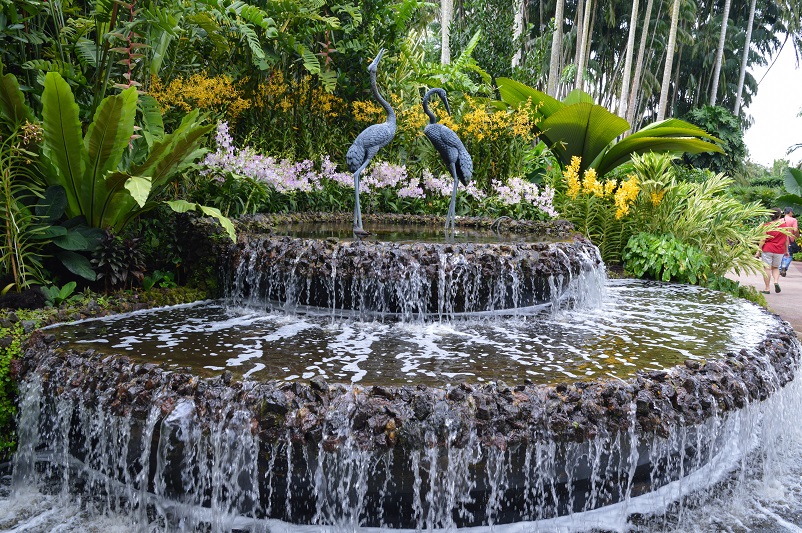 Fountain with two bird statues at the Singapore National Orchid Garden