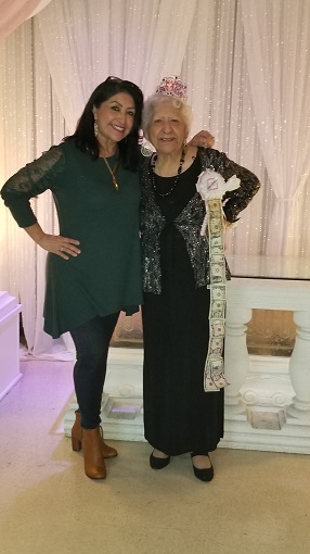 Maria with her friend, another woman all dressed up