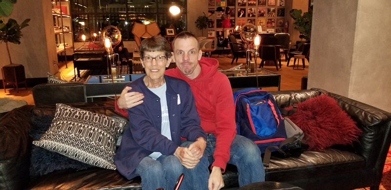 Sally and her son sitting on a couch