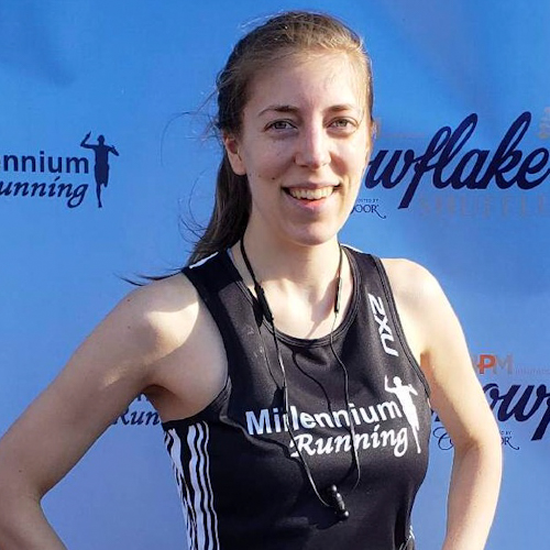 Shea, a woman, standing in her running gear