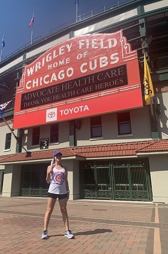 Alex, a woman with LAM, standing in front of Wrigley Field