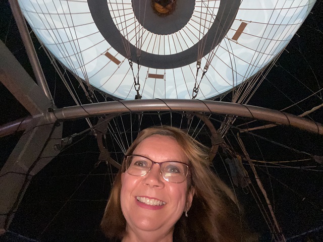 A close up of Susan parasailing